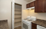 Modern kitchen in a 2BD 1BA apartment in Silver Spring, MD with gas stove and ample storage space.