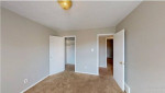 Spacious two-bedroom apartment interior with carpeted flooring and neutral paint in Memphis, TN.