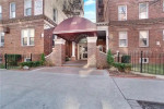 Entrance of a 2-bedroom apartment building at 1900 Quentin Rd Apt C4 in Brooklyn with elegant canopy.