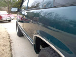 Side view of a 1996 Chevrolet Tahoe LT showcasing its clean exterior and shiny paint finish.