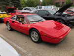 1989 Ferrari 328 GTB in red color, showcasing its flawless condition and low mileage of 9300 miles.