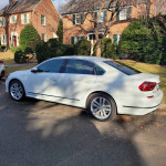 2017 Volkswagen Passat SEL Premium sedan parked, showcasing its sleek design and excellent condition.