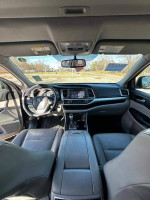 Interior view of 2015 Toyota Highlander XLE with leather seats and modern navigation system