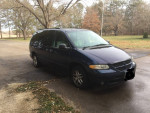 2000 Dodge Grand Caravan minivan with 57,000 miles parked outdoors