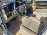Interior view of a 2006 Toyota Land Cruiser with leather seating and dashboard controls.