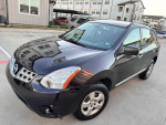 2014 Nissan with 84,000 miles, well-maintained, featuring backup camera and Bluetooth in a parking lot