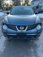 Front view of a gray 2013 Nissan Juke SV, AWD with clean Carfax, navigation, and backup camera.