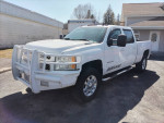 2013 Chevy Silverado 3500 HD white truck with front guard parked outdoors