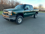 Chevrolet 2500 HD Duramax diesel truck with 126,000 miles, well-maintained and zero rust, parked outdoors.