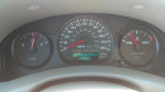 Dashboard of a 2001 Chevrolet Impala showing mileage and fuel levels, ready for sale.