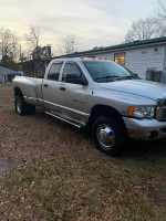 2005 Dodge Ram 3500 Laramie work truck, strong engine, four-wheel drive, parked on grass