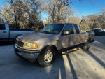 1998 Ford F150 pickup truck with 87,000 original miles, cold AC, and some body damage.