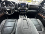 Interior view of a 2020 GMC Sierra 1500 Denali with leather seats and modern dashboard features.