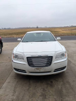 Front view of a white 2014 Chrysler 300 in good shape, highlighting its stylish design.