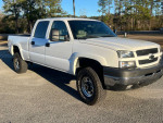 2003 Chevrolet Silverado 1500 with 111,000 miles, showcasing a clean exterior and rugged tires.