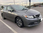 Gray Honda Civic parked, featuring a clean title, reverse camera, and good tires, priced at $6,500.