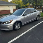 Silver Honda Accord parked, featuring leather seats, Bluetooth, and clean title, ideal for buyers seeking reliable cars.