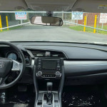 Interior view of a 2017 Honda Civic Sport showcasing dashboard and infotainment system