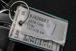 Key fob and tag for a 2018 Honda Civic EX with 197,483 miles, showcasing vehicle details.