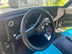 Interior view of a 1978 Chevrolet Malibu Custom Wagon showing the dashboard and two-tone upholstery.
