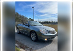 2010 Chrysler Sebring Limited convertible with 141,000 miles parked on a sunny day