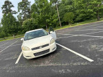 2012 Chevrolet Impala LS for sale, white sedan parked with door open, reliable with 182,357 miles.