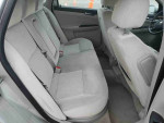 Interior view of a 2011 Chevrolet Impala with spacious seating and clean condition.