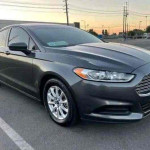 2015 Ford Fusion in gray color, featuring clean title, reverse camera, and automatic transmission.