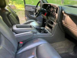 Interior view of a 2003 Chevrolet Silverado 1500 SS showcasing leather seats and dashboard features