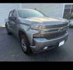 Front view of a 2019 Chevrolet Silverado 1500 LD LT in silver, showcasing its sporty design and features.