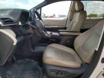 Interior view of a 2021 Toyota Highlander Hybrid Platinum showing comfortable seating and dashboard features.