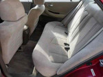 Interior view of a used 2000 Honda Accord SE with beige upholstery and spacious backseat.