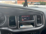 Interior view of a 2014 Dodge Charger R/T with audio controls and dashboard, well maintained vehicle for sale.