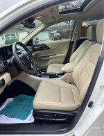 Interior view of 2015 Honda Accord EX showing beige leather seats, dashboard controls, and sunroof.