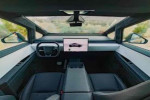 Interior view of 2023 Tesla Cybertruck showcasing modern dashboard and spacious seating.
