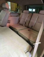 Interior view of a 2007 Chevrolet Tahoe LT with third row seating, leather upholstery, and light wear.