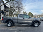 2007 Ford F-150 XLT 4WD extended cab pickup in gray parked outside, showcasing its clean condition and robust design.