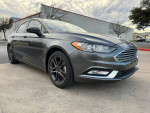 2018 Ford Fusion in gray color with low mileage and modern design, parked on the street