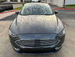 Front view of a grey 2018 Ford Fusion showcasing its stylish design and modern features.