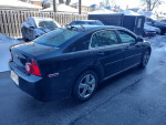 2011 Chevrolet Malibu LT parked, showing sleek design and clean exterior, available for sale at $2,300.