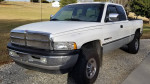 1996 Dodge Ram 1500 Laramie SLT 4x4 in white, excellent condition with clean interior and all-terrain tires.