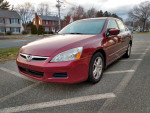 2006 Honda Accord EXL in red, featuring gray leather interior, automatic transmission and moonroof.