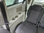 Interior view of a 2008 Dodge Caravan showing seating and cup holder details.