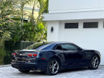 2013 Chevrolet Camaro RS Coupe in dark midnight blue parked in front of a house