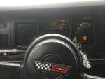 1989 Corvette convertible dashboard with speedometer and performance gauges, showcasing excellent condition