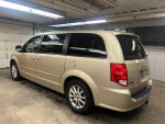 2013 Dodge Grand Caravan in a garage showcasing its clean interior and spacious design