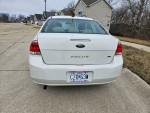 Rear view of a 2011 Ford Focus SE in excellent condition with low mileage.