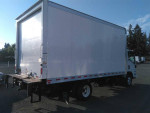 2016 Isuzu NPR Box Truck in excellent condition, showcasing the rear view with bright sunlight.