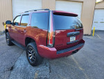 2007 Chevrolet Tahoe LTZ in red, showcasing new wheels and a clean exterior with recent upgrades.