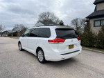 2011 Toyota Sienna LE AWD in excellent condition parked on the street